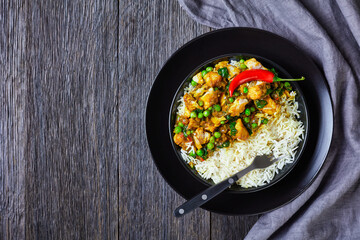 fish curry with green peas in a bowl
