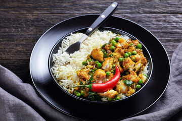 fish curry with green peas in a bowl