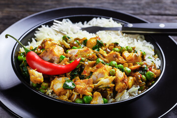 fish curry with green peas in a bowl