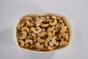 healthy hazelnuts and cashews on white background