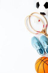 Flat lay of sport balls and rackets on white background. Above view, copy space - obrazy, fototapety, plakaty