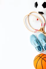Fotobehang Flat lay of sport balls and rackets on white background. Above view, copy space © 9dreamstudio