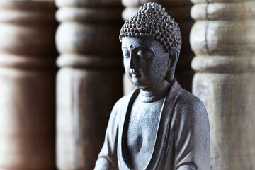 Meditating Buddha Statue on bright background. Close up.	