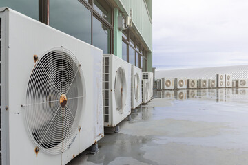 Close up air compressor on rooftop