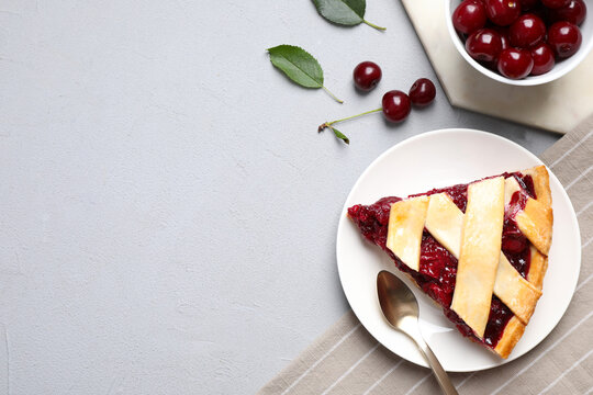 Delicious fresh cherry pie served on light grey table, flat lay. Space for text