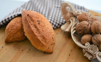 walnuts and nutcracker on wooden table  
homemade breads