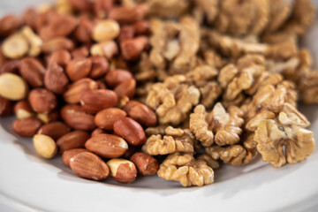 healthy pistachios and walnuts on white background