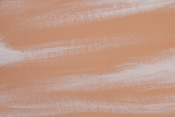 Fototapeta premium texture of beige background with strokes of white paint