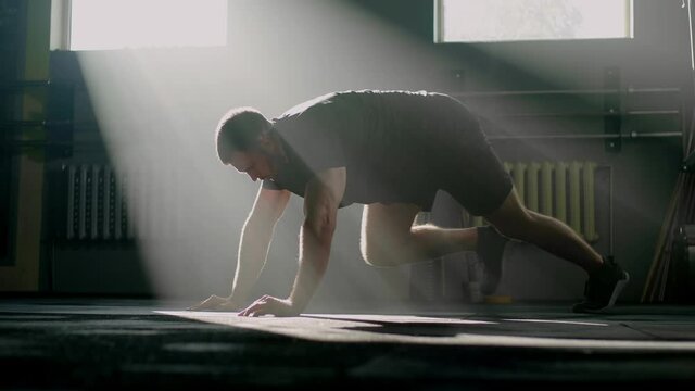 Athletic Man Do Running Plank .