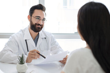 Doctor with patient in medical office