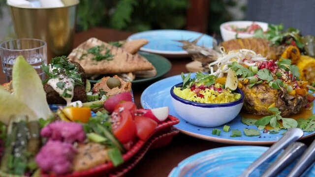 Vegan garden party food. Middle eastern meze of hummus, falafel baba ganoush, tabbouleh and pickles. Thai coconut pineapple curry.