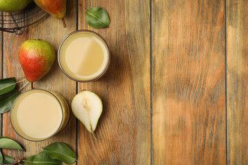 Tasty pear juice, fruits and leaves on wooden table, flat lay. Space for text