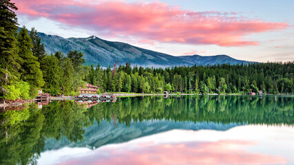 Lake McDonald with a vibrant colorful sunrise in Glacier National Park USA
