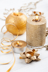 Golden lit aroma candles and Christmas toys