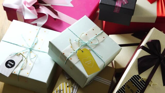 Gift box with ribbon and greeting tag . High angle view