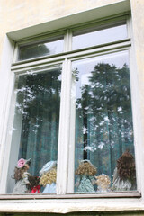 Photos of children's toys on the window. toys behind glass