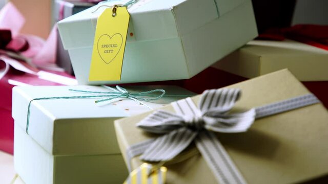 Gift box with ribbon and greeting tag . High angle view