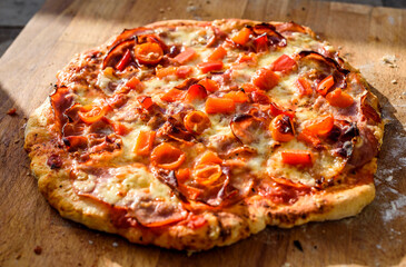 Making of homemade Italian pizza in fireplace brick oven.
