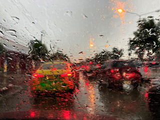 Rain on car window and traffic jams during rain. raining moment on road 