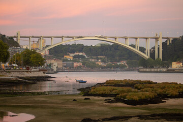 Arrábida Bridge during sunset, city of Porto, Portugal