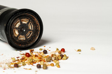 Spicy himalayan salt and pepper mill salt shaker, isolated on yellow background. Copy space for...