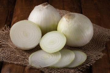 Eco vegetables - fresh sweet white onion on wooden background, vegan food