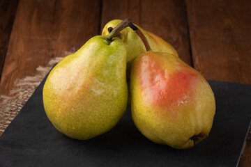 Eco fruit - fresh pear on wooden background, vegan food