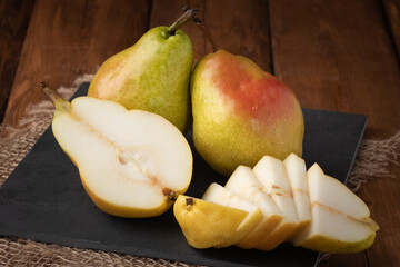 Eco fruit - fresh pear on wooden background, vegan food