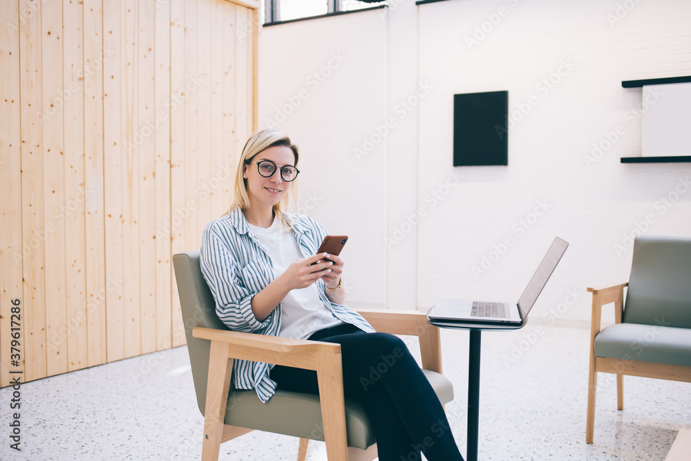 Aufkleber portrait of successful caucasian programmer in optical eyewear smiling at camera during cellular net