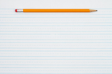 Retro lined school paper with a pencil background