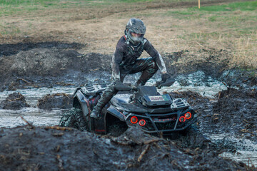Overcoming a route on the off-road vehicle in the mud