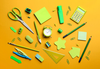 School stationery on orange background, flat lay. Back to school