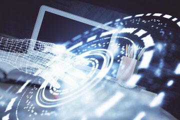 Double exposure of desktop computer and technology theme hologram. Concept of software development.