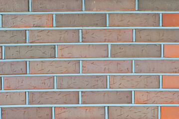 exture of brick wall. new brickwork. Samples of wall or fence are presented at exhibitions. Brown brick close up.