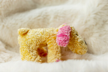 Cute yellow plush puppy toy with pink ears