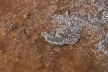 Close up of salt evaporation pools with lye