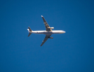 Aeroplane flying high above Sydney Harbour Australia