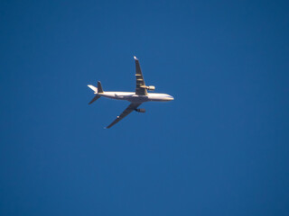 Aeroplane flying high above Sydney Harbour Australia