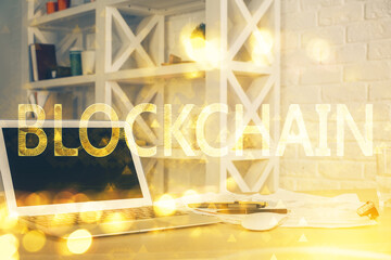 Double exposure of blockchain theme hologram and table with computer background. Concept of bitcoin...