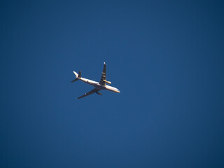 Aeroplane flying high above Sydney Harbour Australia