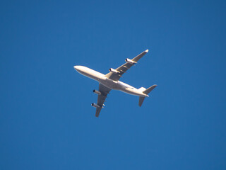 Aeroplane flying high above Sydney Harbour Australia