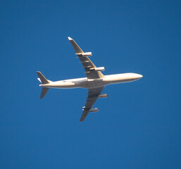 Aeroplane flying high above Sydney Harbour Australia