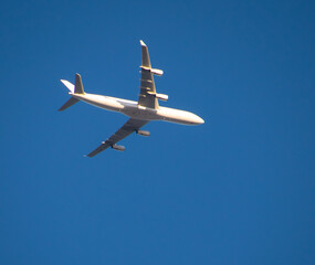 Aeroplane flying high above Sydney Harbour Australia