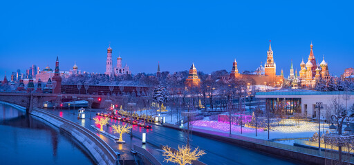 Obraz premium Panorama Moscow. Russia in winter morning. Sights in Moscow in winter. Snow on streets of Russia. Kremlin and St. Basil's Cathedral in distance. Moscow river on morning. Christmas holidays in Russia.