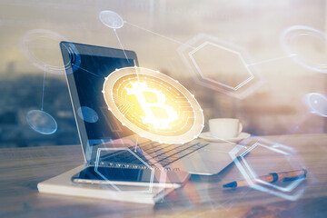 Double exposure of blockchain theme hologram and table with computer background. Concept of bitcoin...