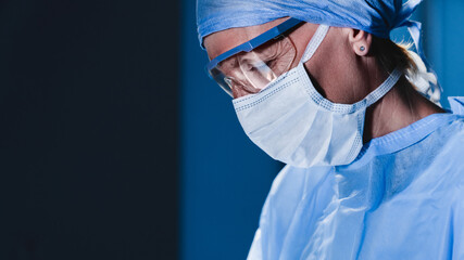 Portrait of senior female doctor surgeon at work.