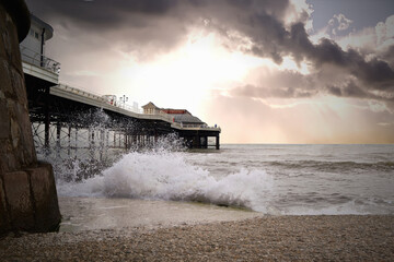 Waves crashing by the pier