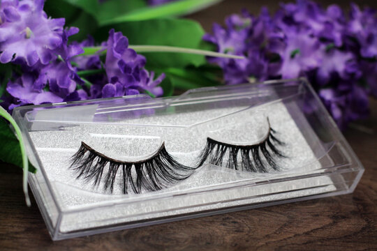 Pair Of Fake False Eyelash And Purple Flowers