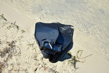 swimming fins and diving mask on the beach