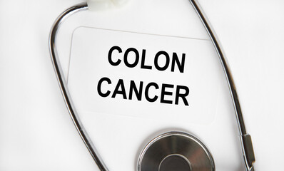 Colon Cancer - inscription on the tablet for writing, next to the stethoscope.
